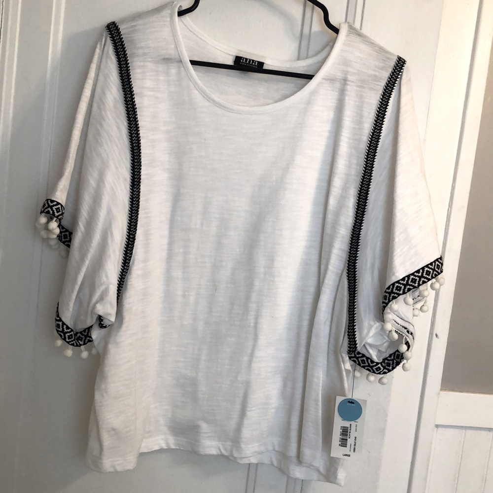 Shirt with oversized sleeves and tassles